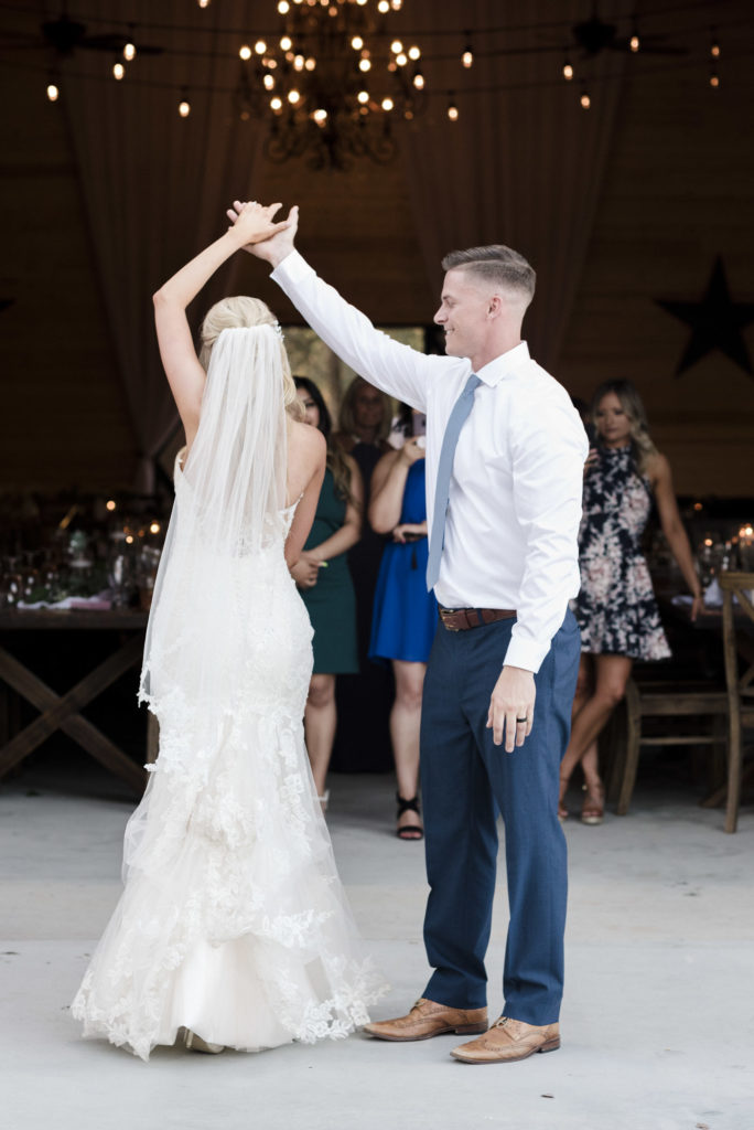 bride and groom twirling during first dance
