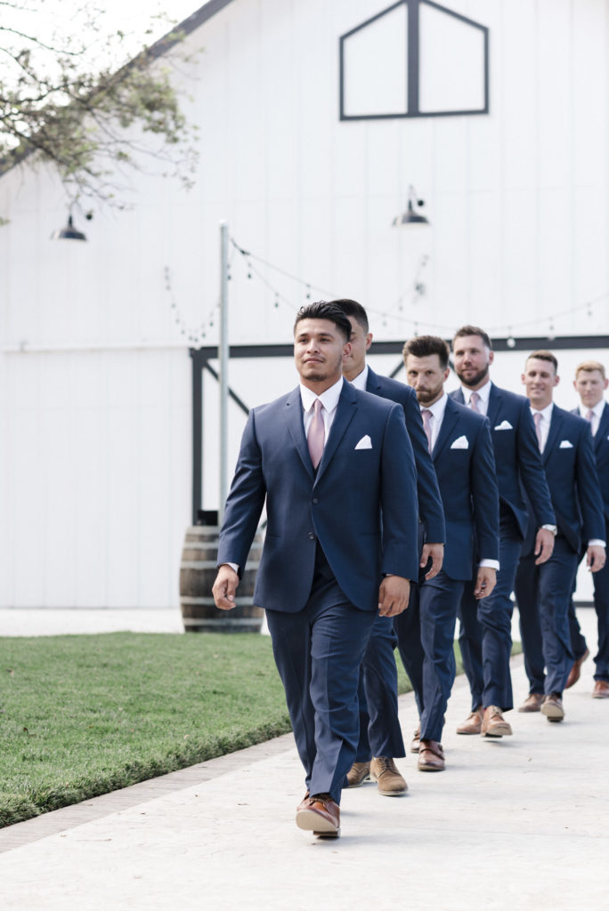 groomsmen walking down the aisle