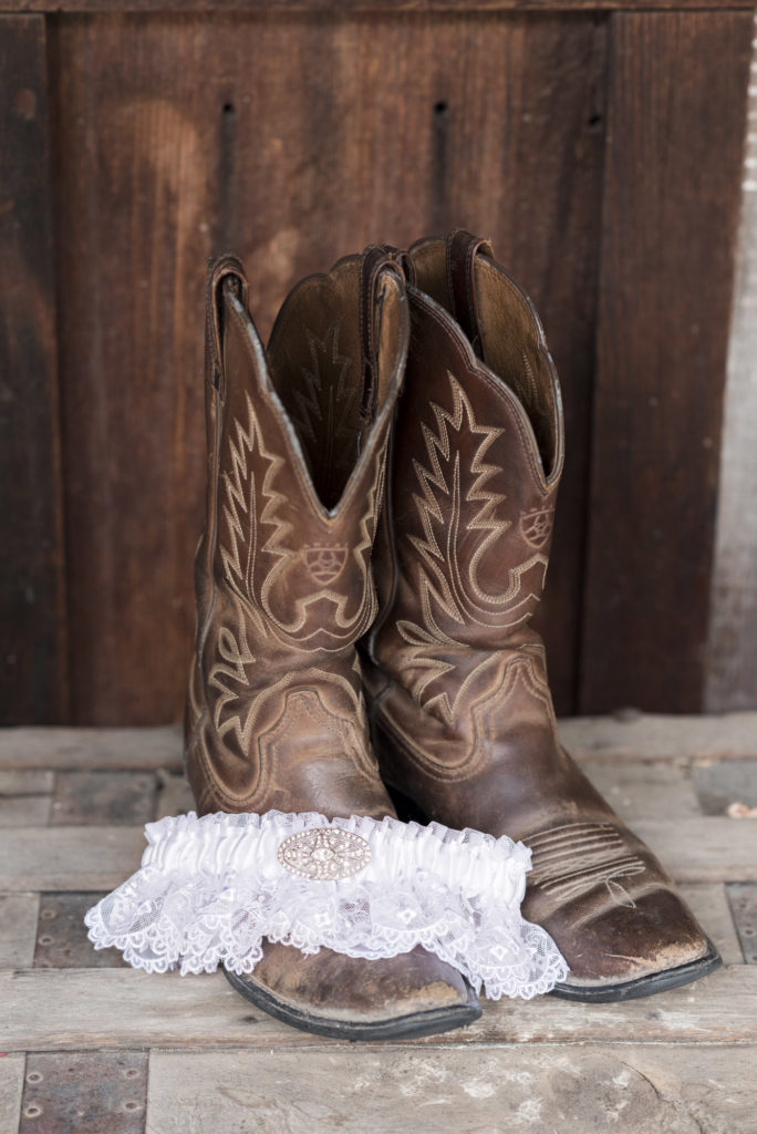 bride's western boots with white lace garter
