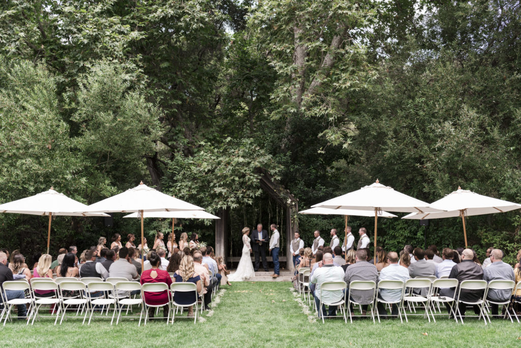 guests enjoying wedding ceremony in a garden