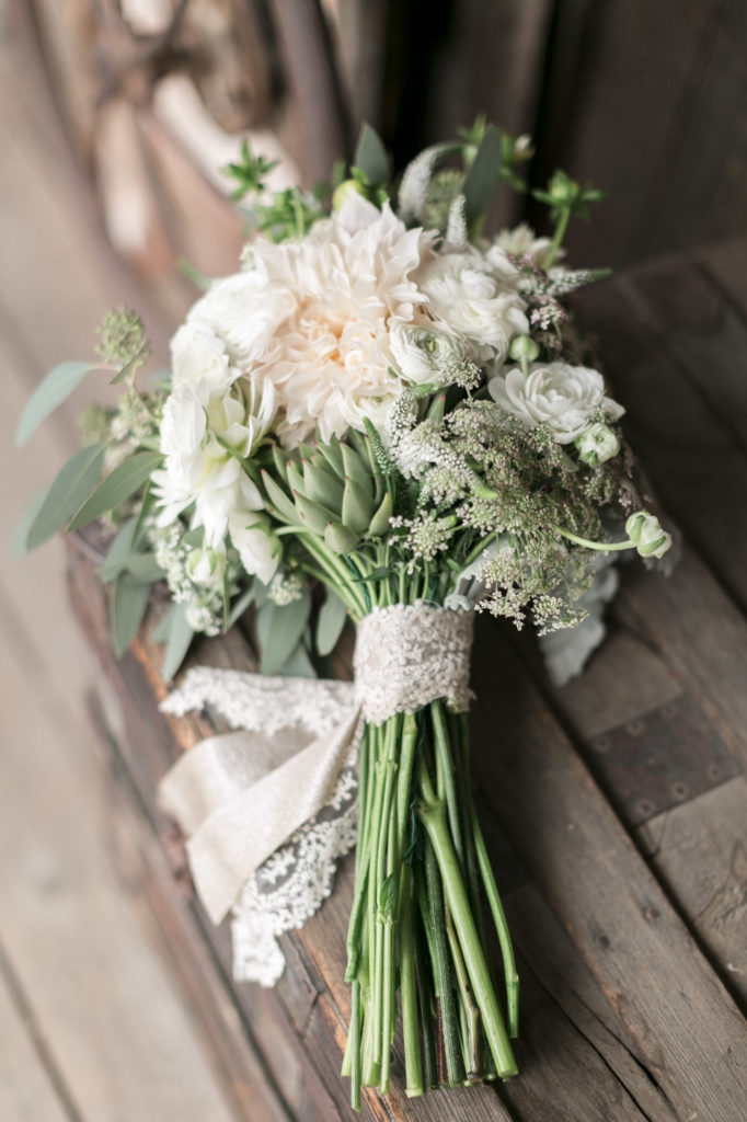 Soft white and blush bridal wedding bouquet with lace ribbon detail