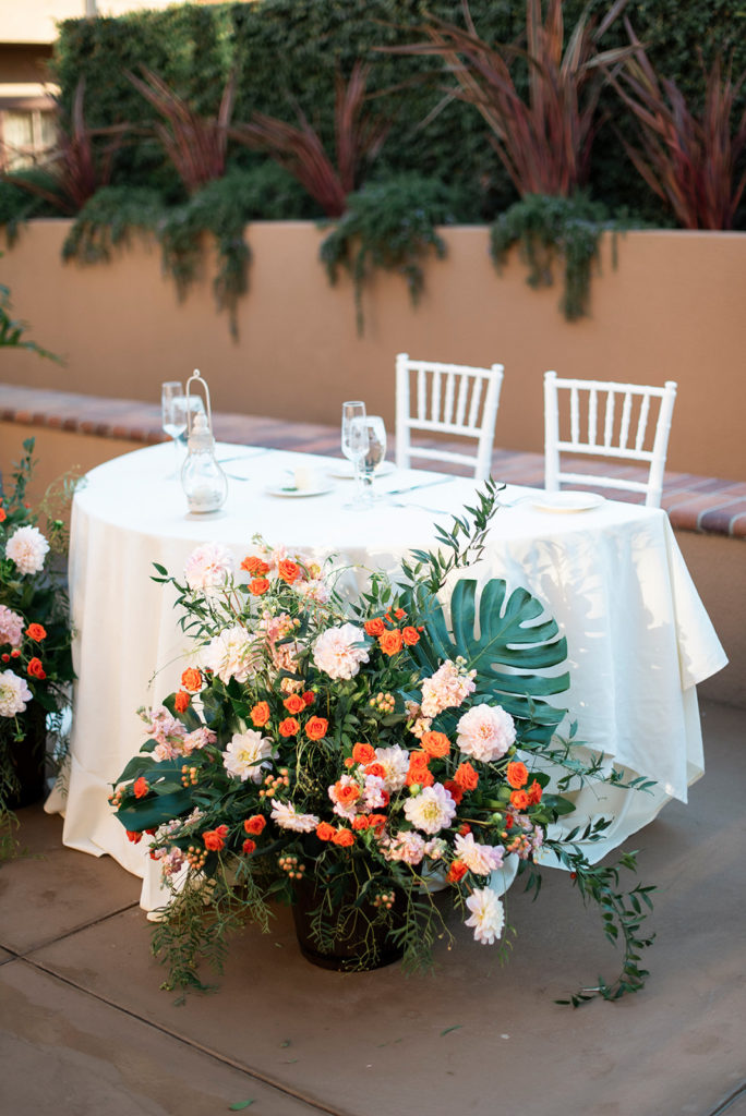 Tropical Wedding Reception Flowers with Palm Leaves