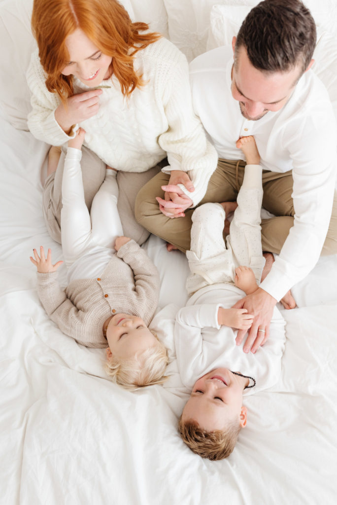 Light Neutral Family Photos with white outfits by Kirsten Bullard